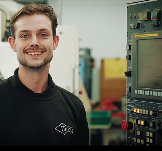 Unicut Precision team member on the manufacturing floor